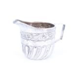 A Victorian silver cream jug, Charles Edwards, London, 1895, 53 g