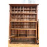 A Victorian pitch pine Post Office sorting room cabinet, lined with varying sizes of pigeon holes,