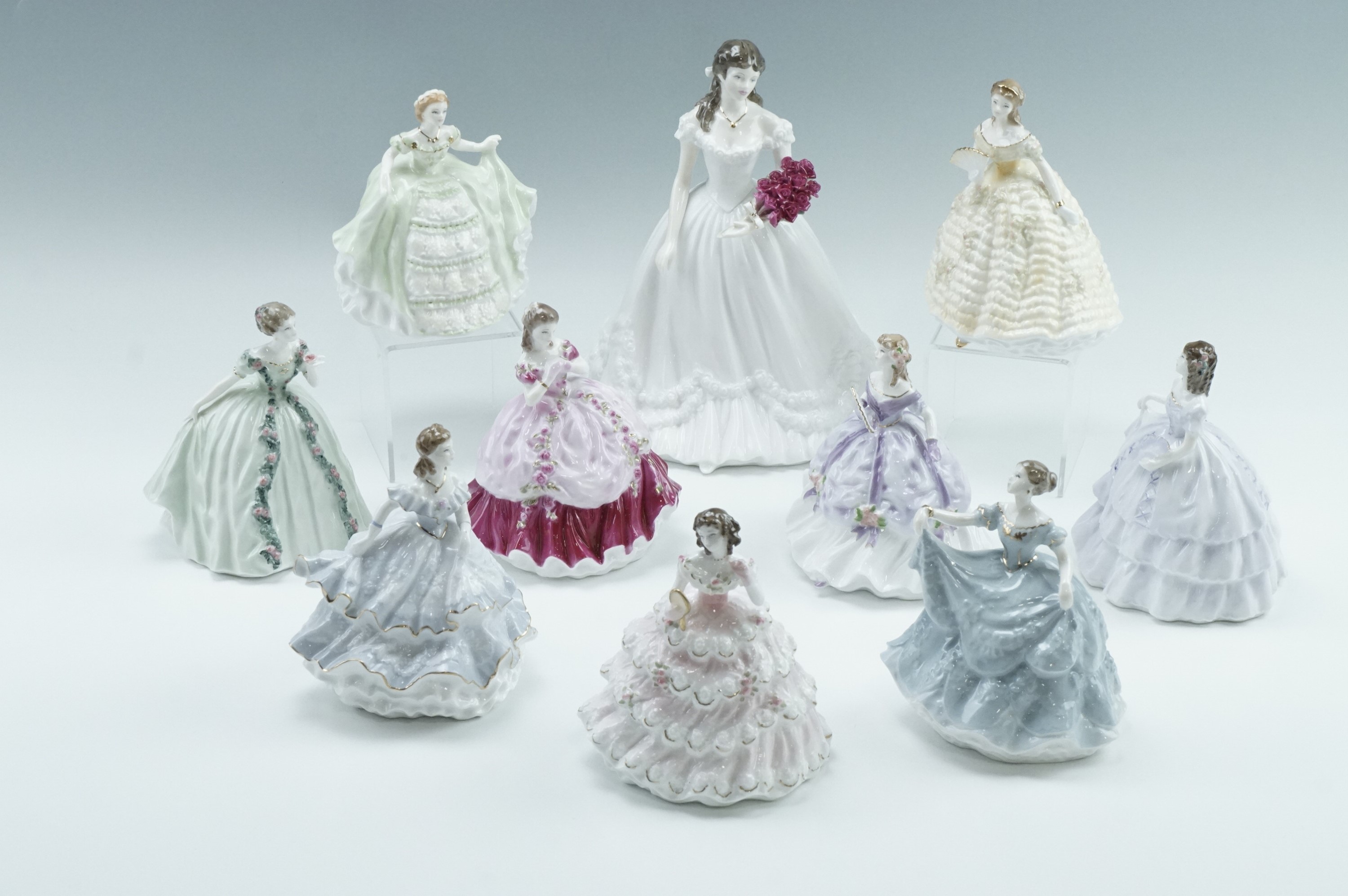 Nine Royal Worcester limited edition Debutantes figurines, together with Anniversary Figure of the