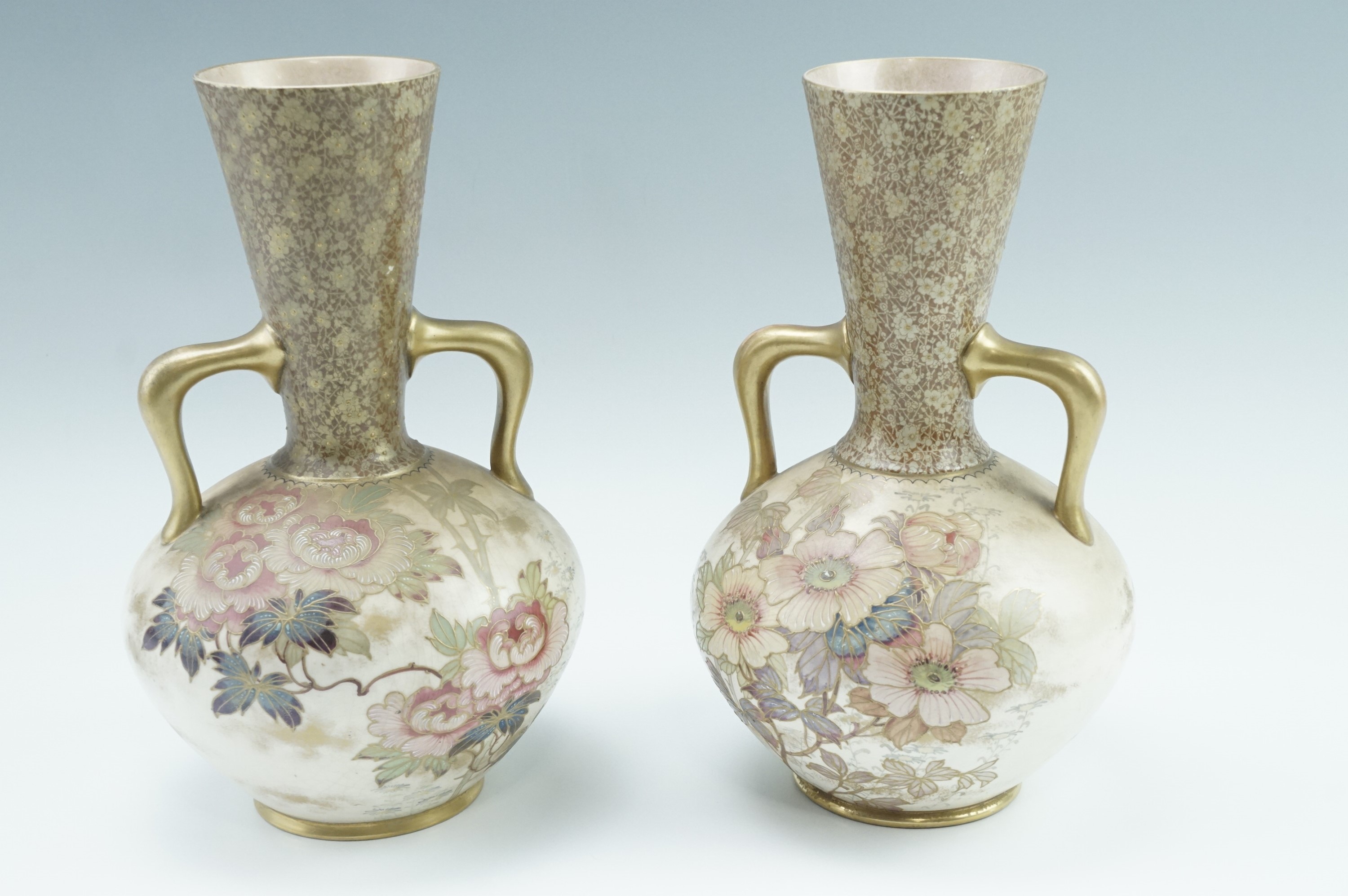 A pair of late 19th Century Doulton Burslem two handled vases, of ovoid form with an inverted