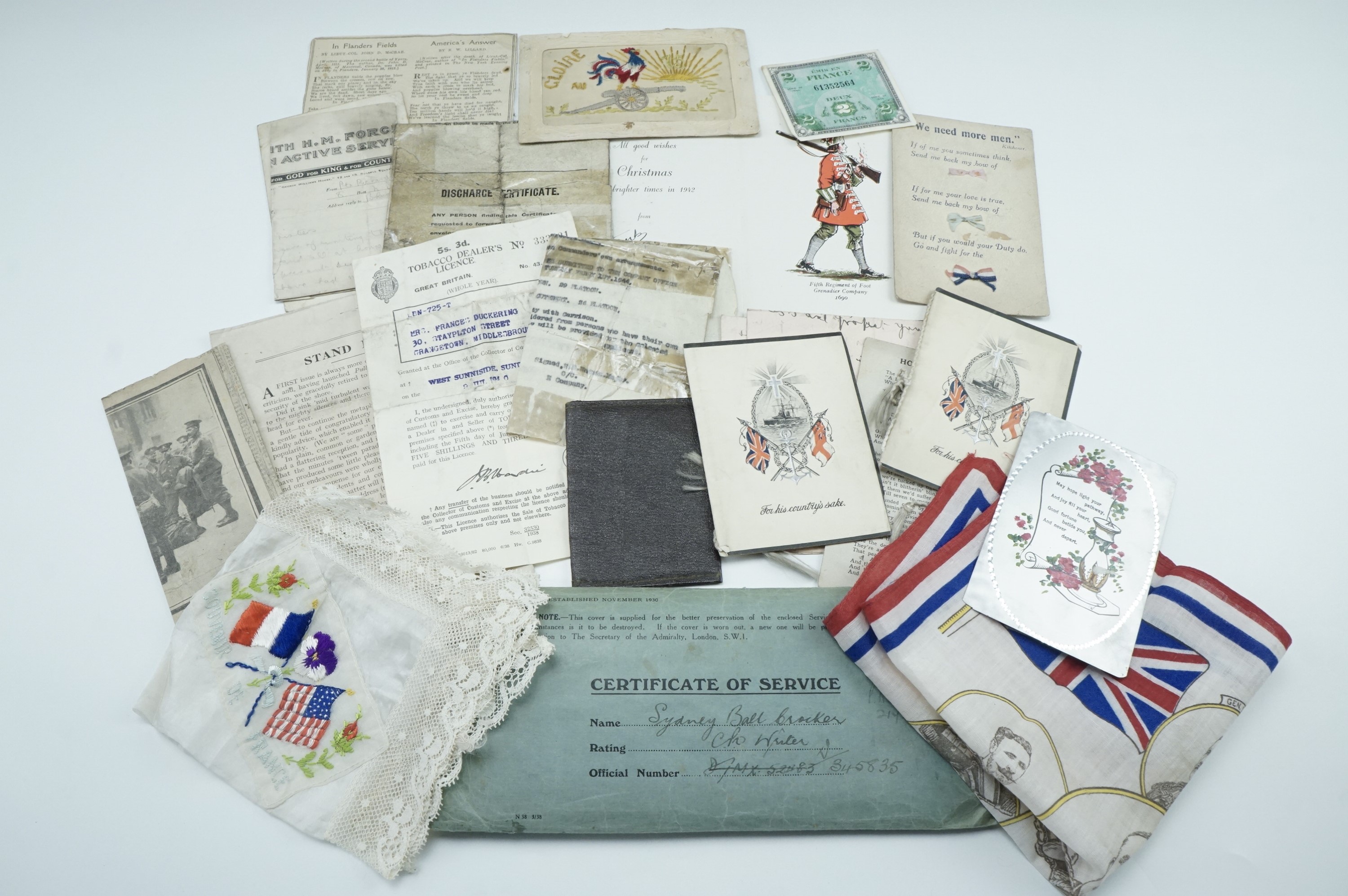 A quantity of military ephemera and patriotic souvenirs including a silk postcard, a printed