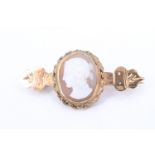 An early 20th Century 9 ct yellow metal cameo brooch, having a classical lady's head in profile,
