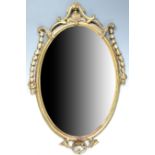 A 19th Century Adam style oval gilt frame mirror, decorated with scrolls and trailing laurel leaves,