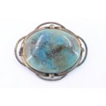 An early 20th Century Ruskin cabochon brooch, in gilt metal mount, cabochon 4 cm x 2 cm