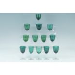 Nine Victorian emerald glass wine glasses, together with four other similar glasses, tallest 13 cm
