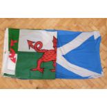 Two vintage cotton Wales flags together with two Scotland flags, approximately 190 x 185 cm