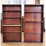 A pair of late Victorian mahogany open-fronted bookcases, having adjustable wooden shelves, 74 cm