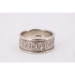 An Ola Gorie Scottish silver band, bearing a relief inscription 'Tha Gaol agam ort' [I love you],