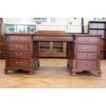 A contemporary reproduction Georgian partners' mahogany desk, having a gilt-tooled inset leather