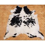 A cowhide rug, 203 x 195 cm