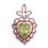 A Belle Époque peridot and diamond brooch, the central 12 x 11 mm peridot retained by the