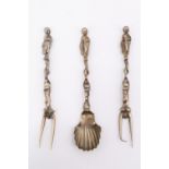Two 19th Century Dutch cast paktong condiment forks and a spoon, having naturalistic stems and