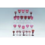 Six various Victorian ruby glass wine glasses, and four custard glasses, together with flashed and