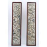 A pair of early 20th Century Chinese embroidered silk panels, in moulded frames under glass, circa