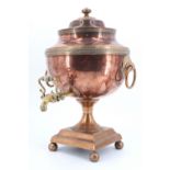 A Regency copper tea urn, having a lever tap with an ivory insulator, 43 cm high
