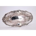 A Victorian silver elongated oval dish, Rococo influenced and having a foliate- and C-scroll rim