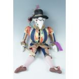 A late 20th Century handmade cloth doll "Polichinelle", together with a conforming book: Peter