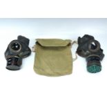 Two Second World War British Home Front Civilian Duty gas masks and a haversack