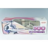 A boxed Syma "300 Schweizer" radio controlled helicopter