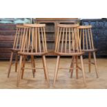 A set of four Ercol style comb-back Windsor kitchen / dining chairs