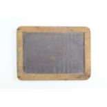 A late 19th / early 20th Century school student's slate board, 30 x 22 cm