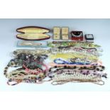 A large quantity of boxed and loose costume jewellery bead necklaces