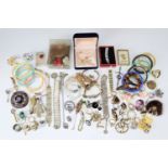 A quantity of late 20th Century costume jewellery bangles, bracelets, brooches and rings