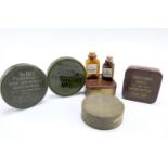 Two British army water sterilising outfits, webbing renovator, dubbin and a cake of Blanco