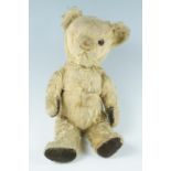 A vintage mohair Teddy bear, having articulated joints, a glass eye and growler mechanism, second