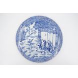 A Chinese blue and white dish, decorated in depiction of a marshal scene, bearing a four character