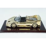 A Goldshield Collectables gold Ferrari F50 diecast model car