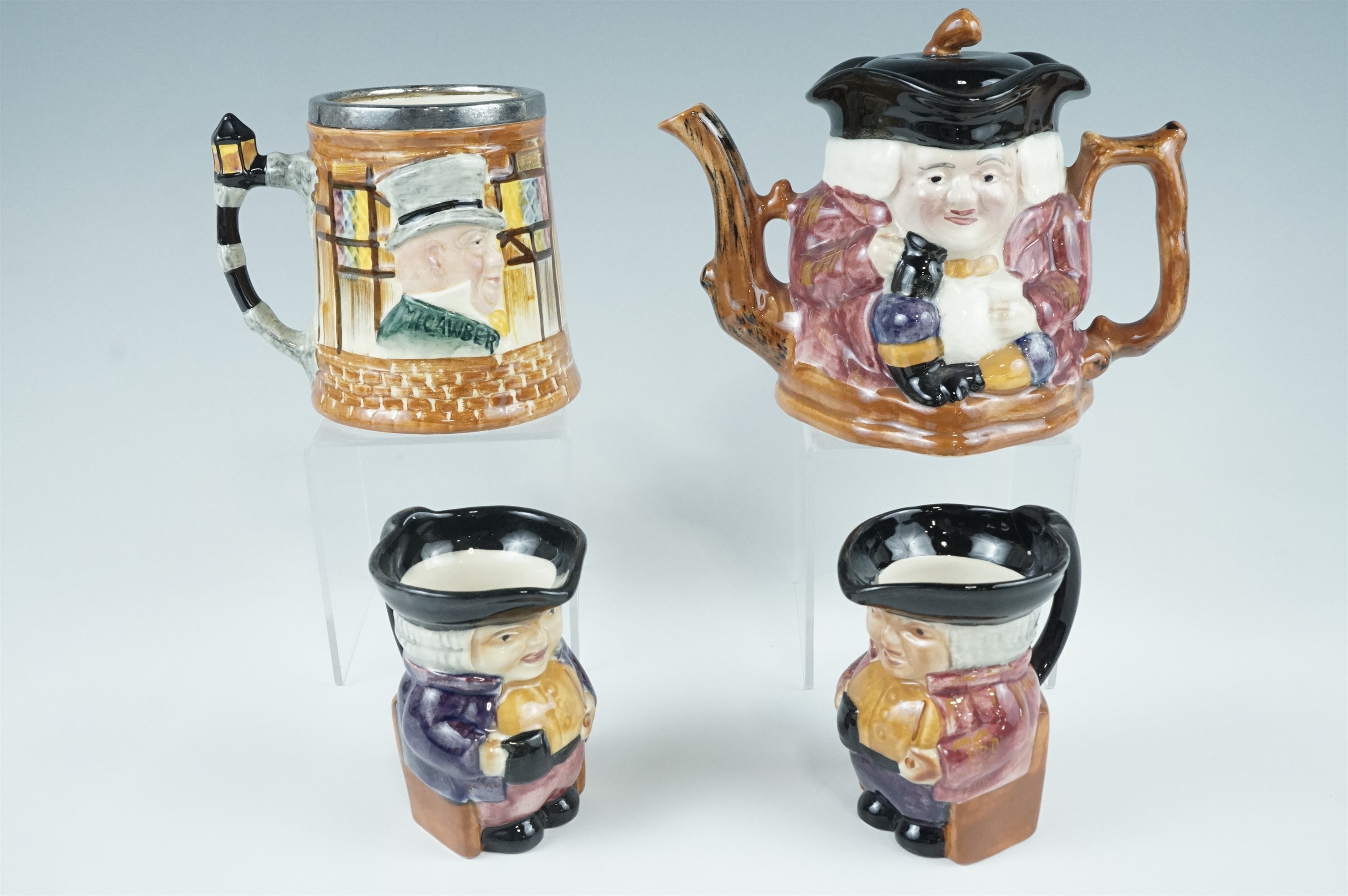 A Shorter character teapot together with two jugs and a tankard, 12.5 cm
