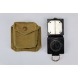 A Second World War British military Mark I Magnetic Marching Compass and Pattern 1937 compass pouch
