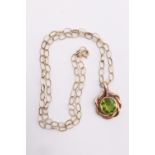 A vintage tsavorite / peridot and yellow metal necklace, the 11 x 10 mm brilliant cut stone in a