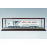 A BOC Baker diecast lorry, in wood and glass display case, likely Smith Auto Models, 44 x 13 x 12.