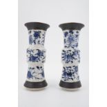 A pair of 20th Century Chinese blue and white crackle ware vases, of baluster form with an everted
