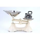 A set of reproduction cast iron kitchen scales together with a group of bell weights, scales 26 x 19