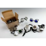 A quantity of new old stock vintage safety goggles and respirators, some boxed, [rescued from the