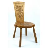 A carved Wellbrook College Sherwood oak spinning type stool by Wren Craftsmen of Carburton, Worksop,