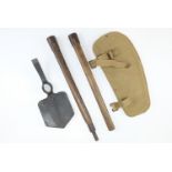 A 1940 dated British army spade type entrenching tool with reproduction webbing carrier, a sirhind