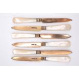 A set of six mother of pearl handled silver gilt fruit knives, Goldsmiths and Silversmiths Co Ltd,