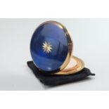 A vintage Stratton compact, dark blue and having a bright cut star as decoration, 8 cm diameter