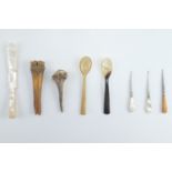 An 18th / 19th Century carved bone apple corer, an antler bodkin, horn spoons, mother of pearl