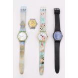 Three Swatch wristwatches together with a vintage Snoopy watch