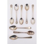 Five George V silver teaspoons having shell terminals, together with three various Georgian