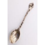A nine matching Victorian silver coffee spoons, the naturalistically cast handles decorated with