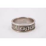 An Ola Gorie Scottish silver band, bearing a relief inscription 'Tha Gaol agam ort' [I love you],