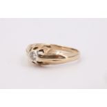 A 1970s diamond and 9 ct gold solitaire ring, having a 3.5 mm brilliant diamond flush set on a