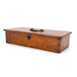 A Victorian oak hinge-lidded box, having a brass bale handle and shield-shaped keyhole escutcheon,