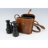 A Great War or earlier cased set of officer's private purchase binocular field glasses, the case